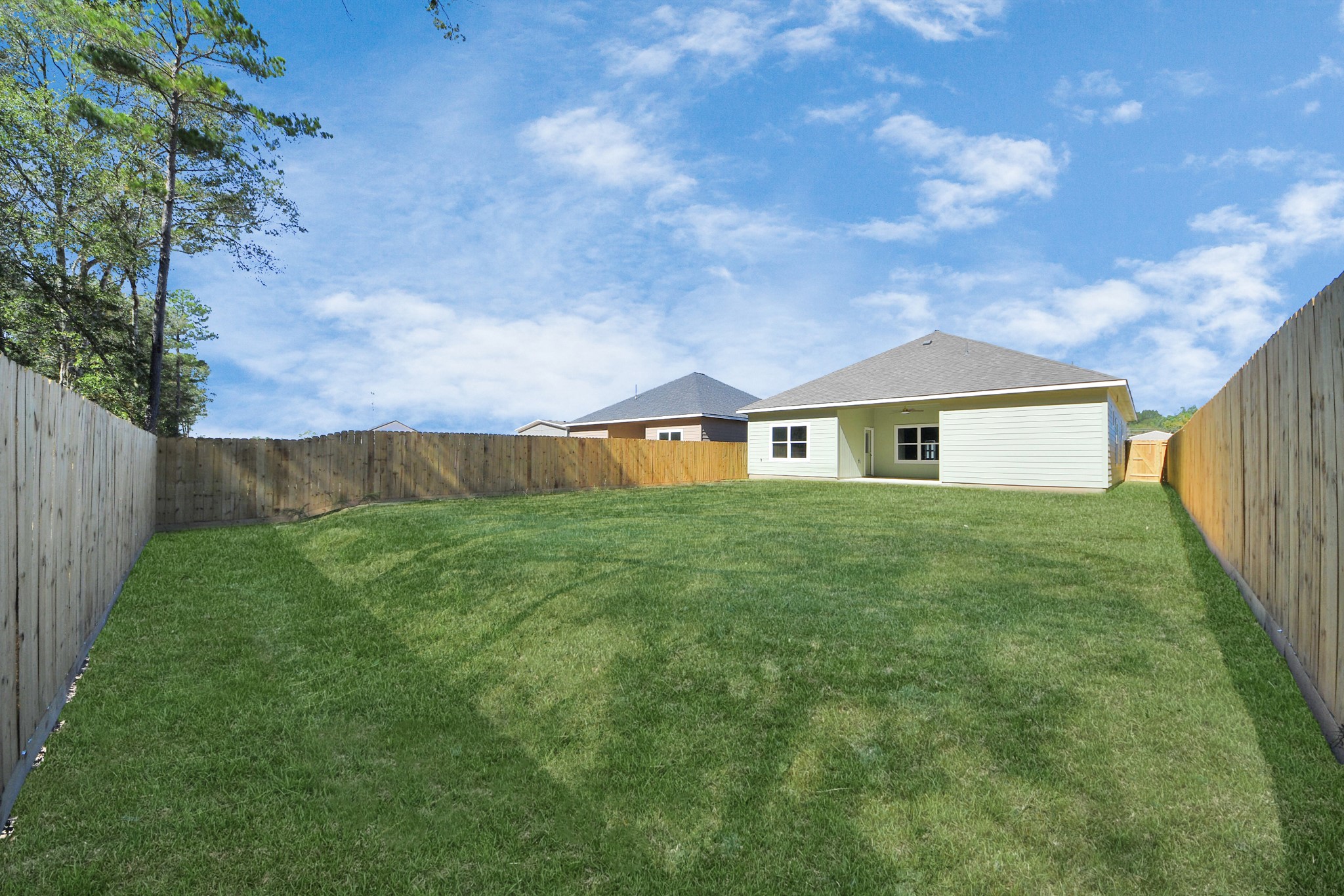 16280 Jeet Street Conroe, TX 77306 - Photo 42 of 44 a view of an house with backyard space and garden