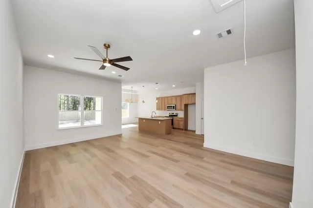 a view of a kitchen with a sink and a window