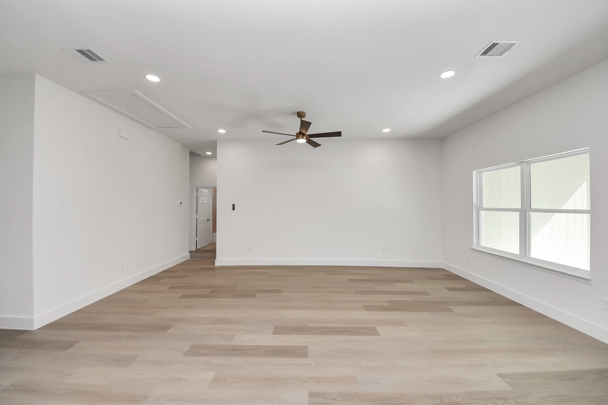 16280 Jeet Street Conroe, TX 77306 - Photo 8 of 44 a view of an empty room with a window