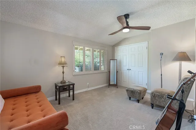 a bedroom with furniture and a window