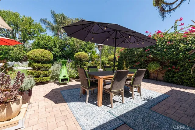 a patio with a patio table and chairs