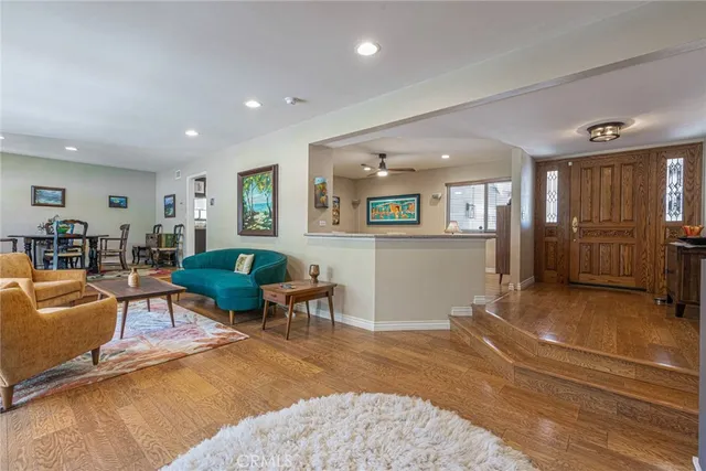 a living room with furniture and large window