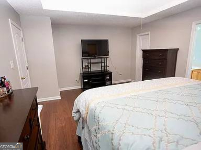 108 Christine Circle Perry, GA 31069 - Photo 12 of 23 a bedroom with a bed and a television