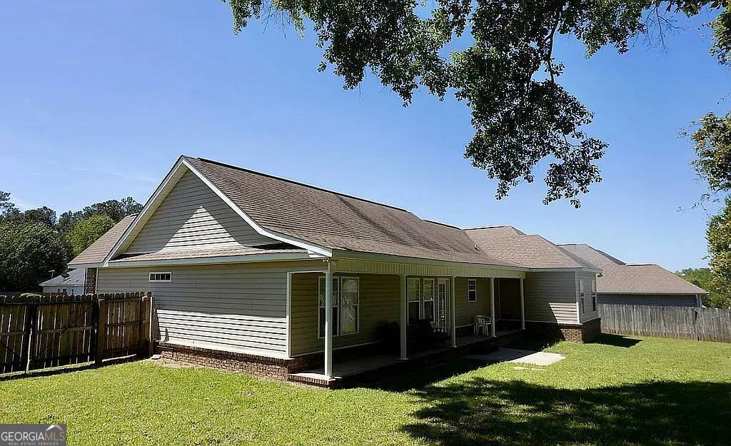 108 Christine Circle Perry, GA 31069 - Photo 22 of 23 a front view of a house with a yard