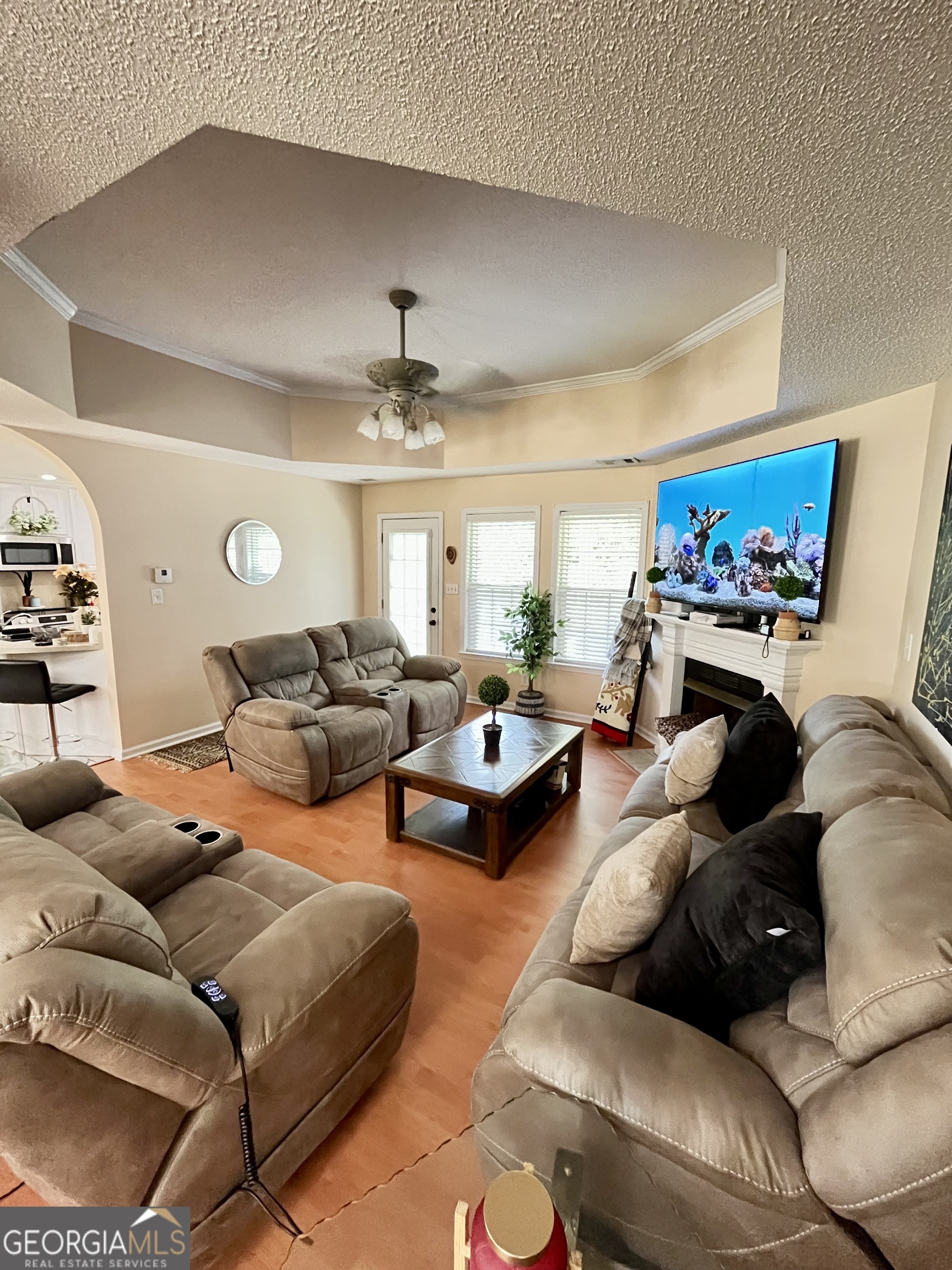 108 Christine Circle Perry, GA 31069 - Photo 4 of 23 a living room with furniture and a chandelier