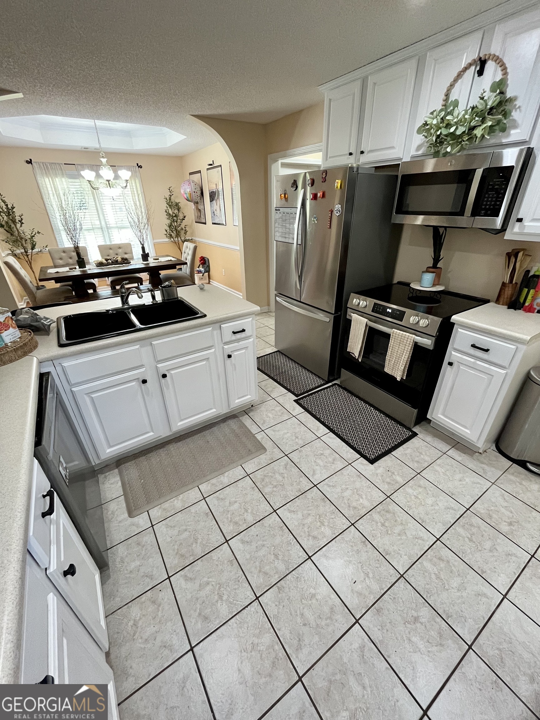 108 Christine Circle Perry, GA 31069 - Photo 8 of 23 a kitchen with stainless steel appliances a refrigerator and a stove