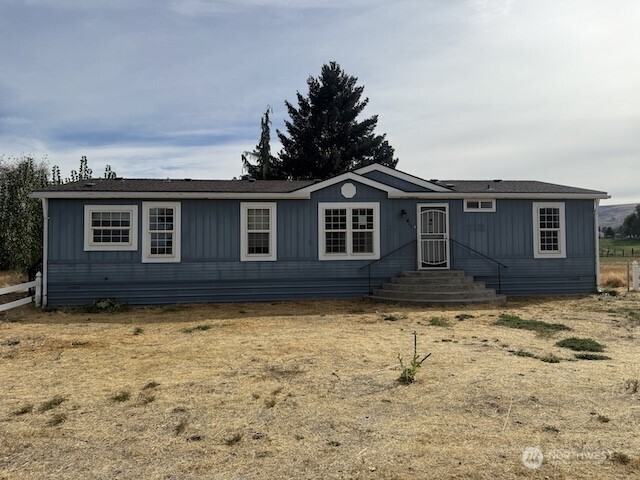 411 Sheets Road Yakima, WA 98901 - Photo 1 of 28 a house with trees in the background