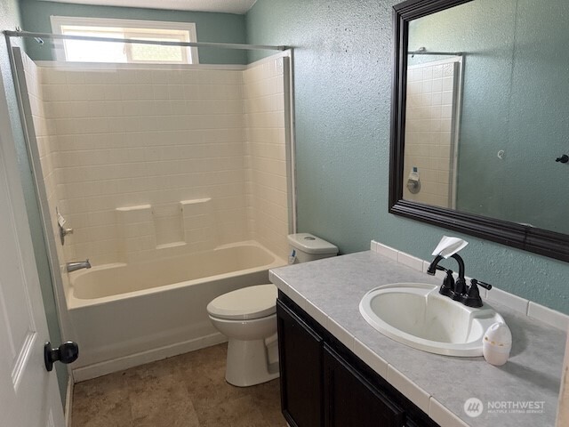 411 Sheets Road Yakima, WA 98901 - Photo 15 of 28 a bathroom with a sink a toilet and shower