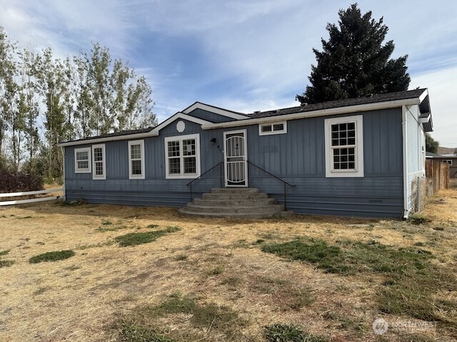 411 Sheets Road Yakima, WA 98901 - Photo 16 of 28 a house with a large tree in front of it