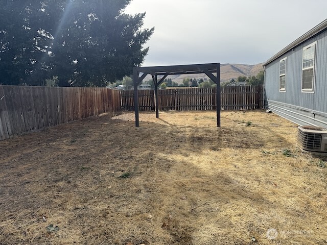 411 Sheets Road Yakima, WA 98901 - Photo 22 of 28 a view of backyard with wooden fence