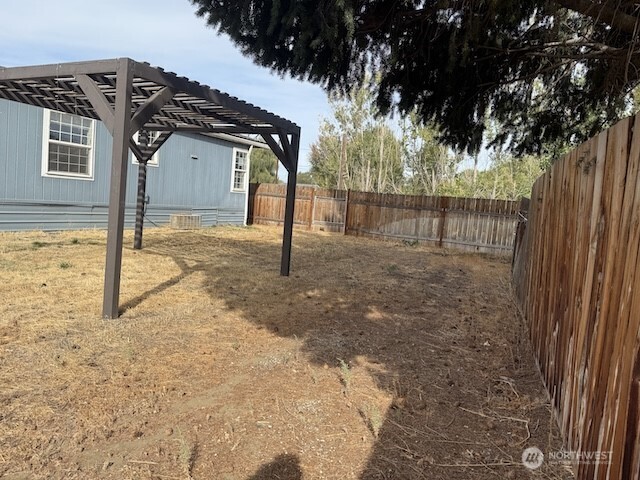 411 Sheets Road Yakima, WA 98901 - Photo 25 of 28 a view of a house with a snow in the yard