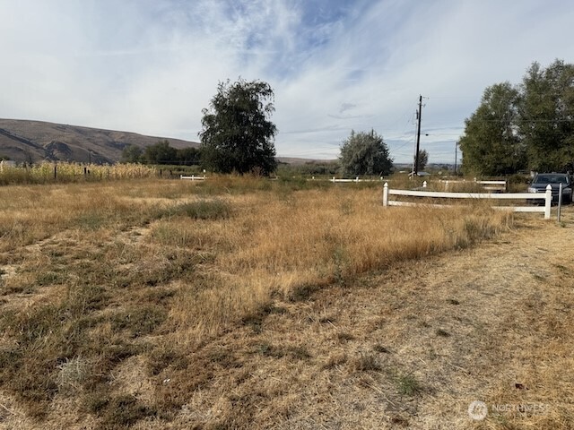411 Sheets Road Yakima, WA 98901 - Photo 27 of 28 a view of a yard with an ocean view