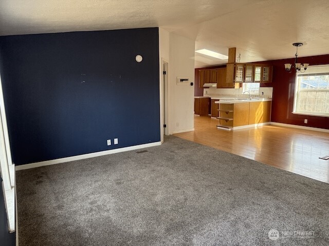 411 Sheets Road Yakima, WA 98901 - Photo 3 of 28 an empty room with wooden floor and windows