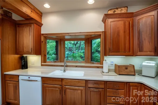 a view of a livingroom with furniture and a window