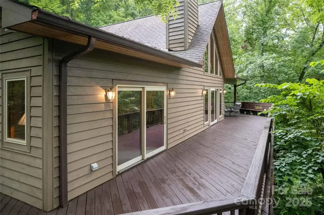 a view of a wooden door and a yard