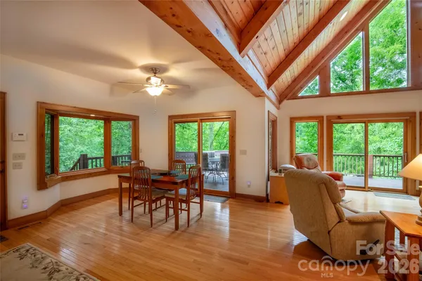 a kitchen with stainless steel appliances wooden cabinets a sink and a large window