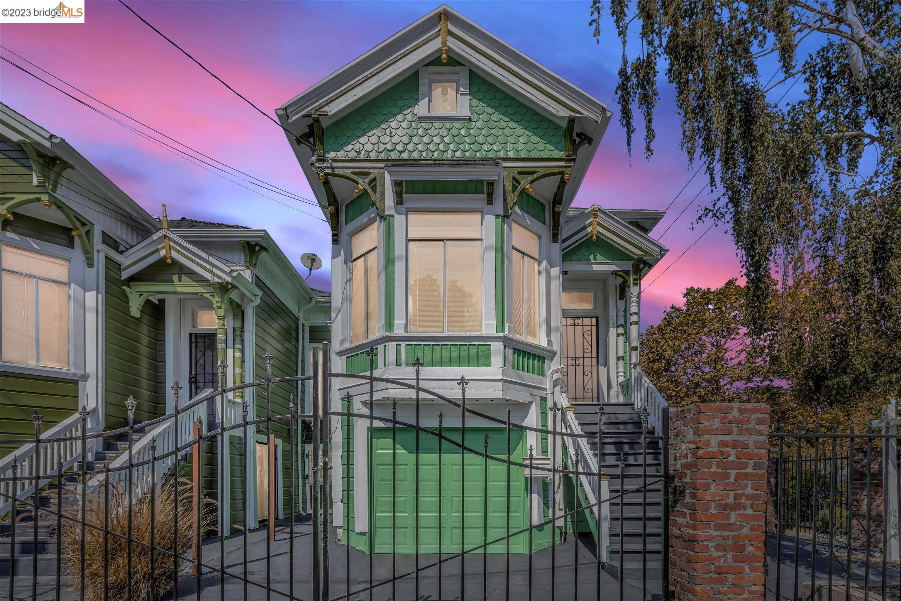 a view of a house with a iron gate