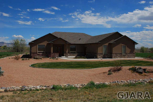 1682 14 Road Loma, CO 81524 - Photo 1 of 27 a front view of a house with a yard