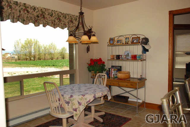 1682 14 Road Loma, CO 81524 - Photo 13 of 27 a view of a dining room with furniture window and outside view