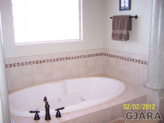 1682 14 Road Loma, CO 81524 - Photo 17 of 27 a bathroom with a bathtub and shower