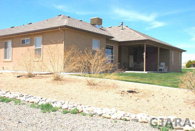 1682 14 Road Loma, CO 81524 - Photo 20 of 27 a front view of a house with a yard
