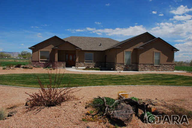 1682 14 Road Loma, CO 81524 - Photo 2 of 27 a front view of a house with a yard