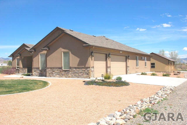 1682 14 Road Loma, CO 81524 - Photo 21 of 27 a front view of a house with a yard