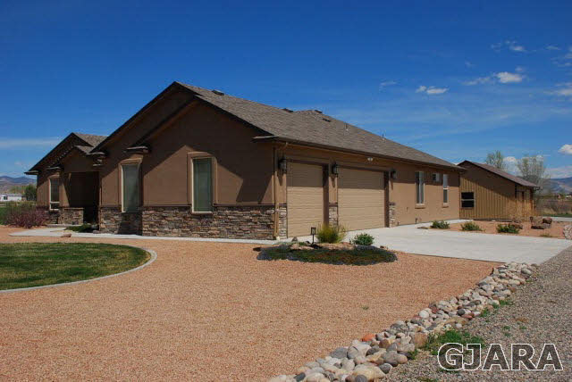 1682 14 Road Loma, CO 81524 - Photo 3 of 27 a front view of a house with a yard