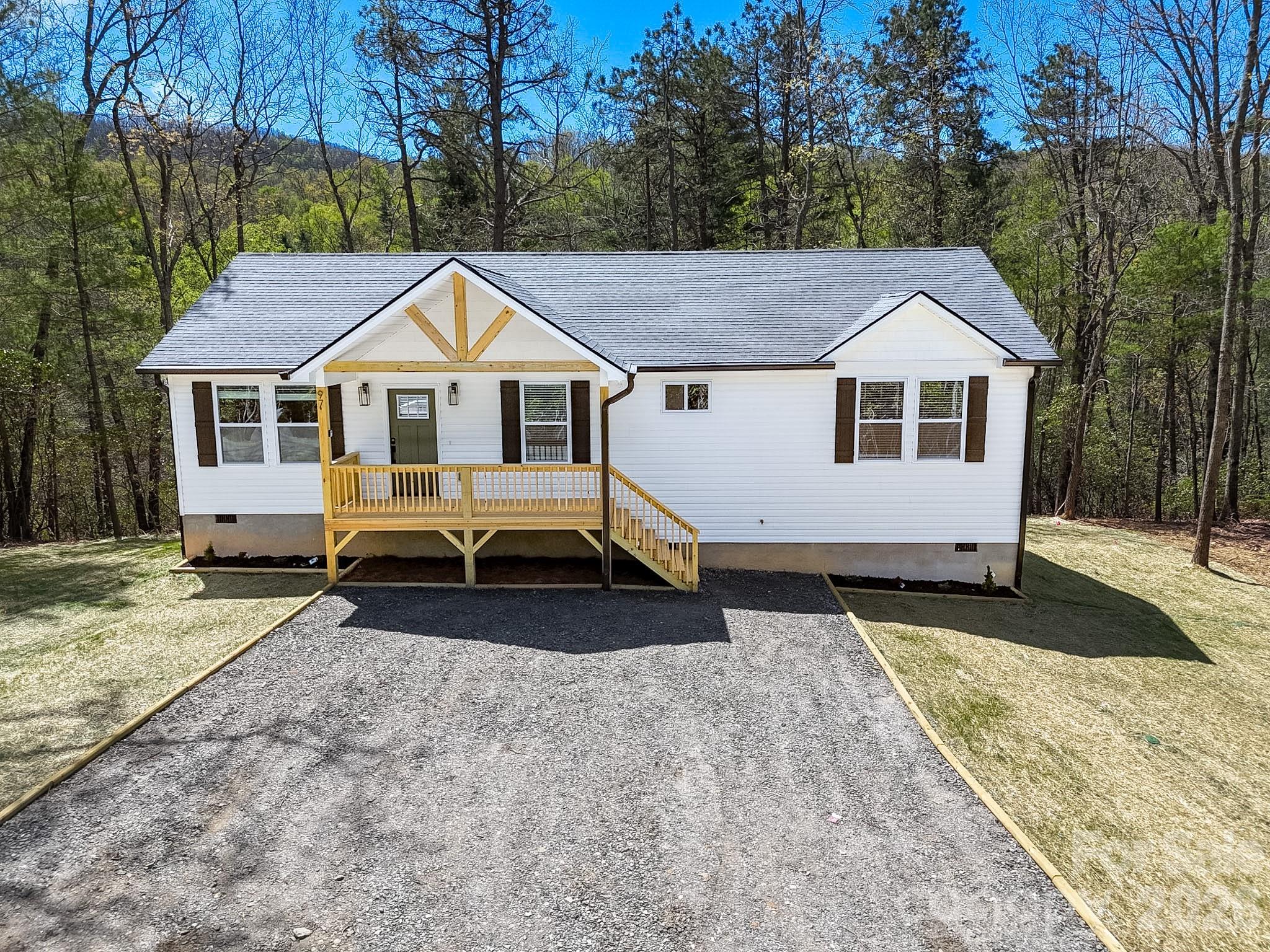 97 Lee Dotson Road Fairview, NC 28730 - Photo 3 of 45 a house view with a outdoor space