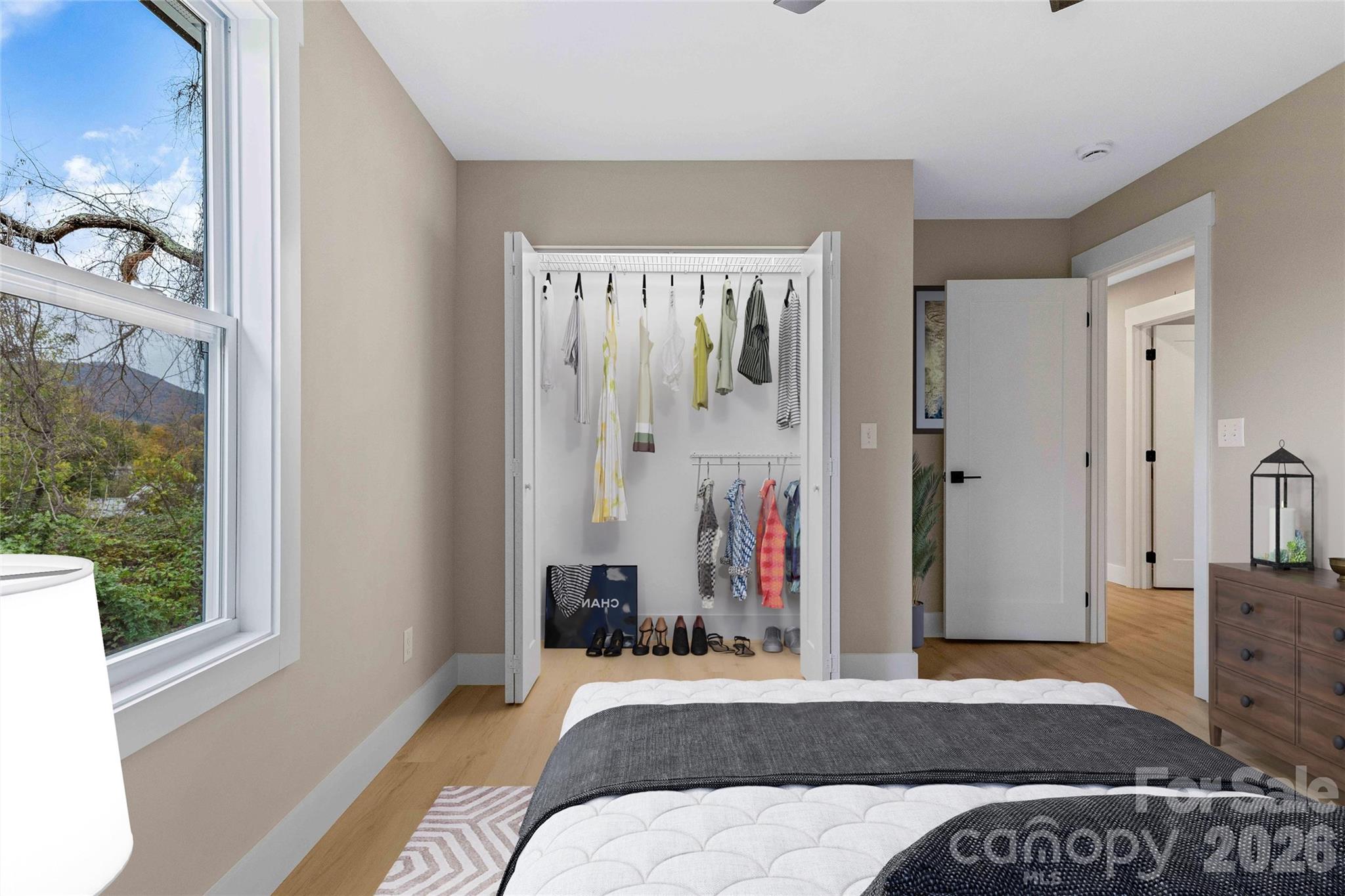 97 Lee Dotson Road Fairview, NC 28730 - Photo 41 of 45 a bedroom with a bed and a window
