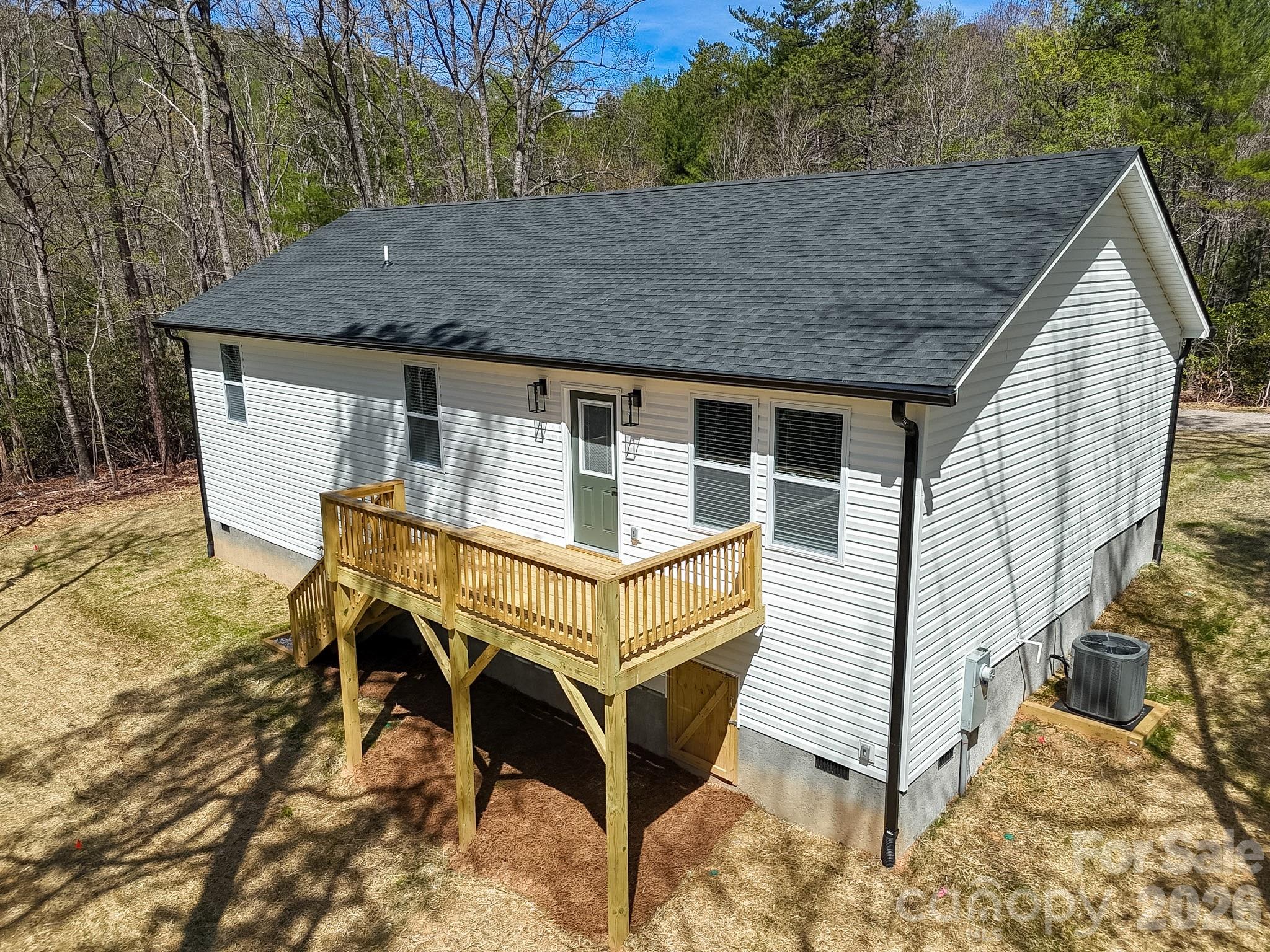 97 Lee Dotson Road Fairview, NC 28730 - Photo 5 of 45 a view of a house with backyard and trees