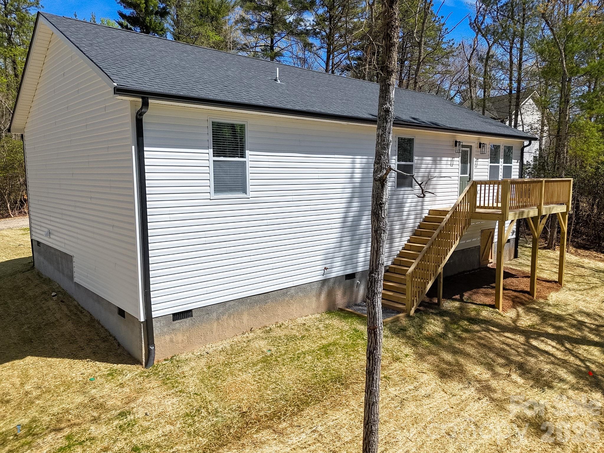 97 Lee Dotson Road Fairview, NC 28730 - Photo 6 of 45 a view of a patio with wooden fence