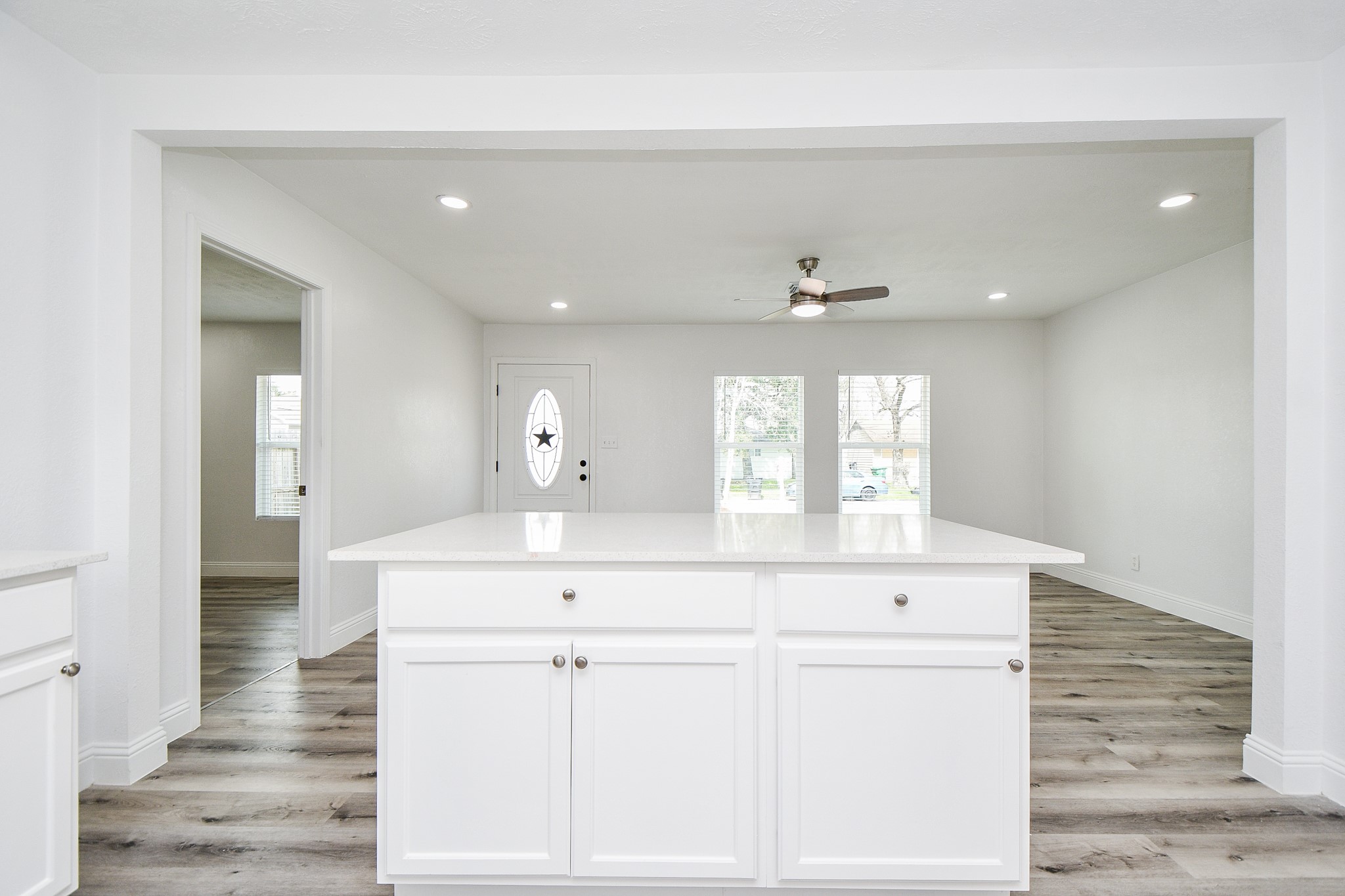 5814 Belneath Street Houston, TX 77033 - Photo 16 of 32 a view of cabinets a sink and dishwasher with wooden floor