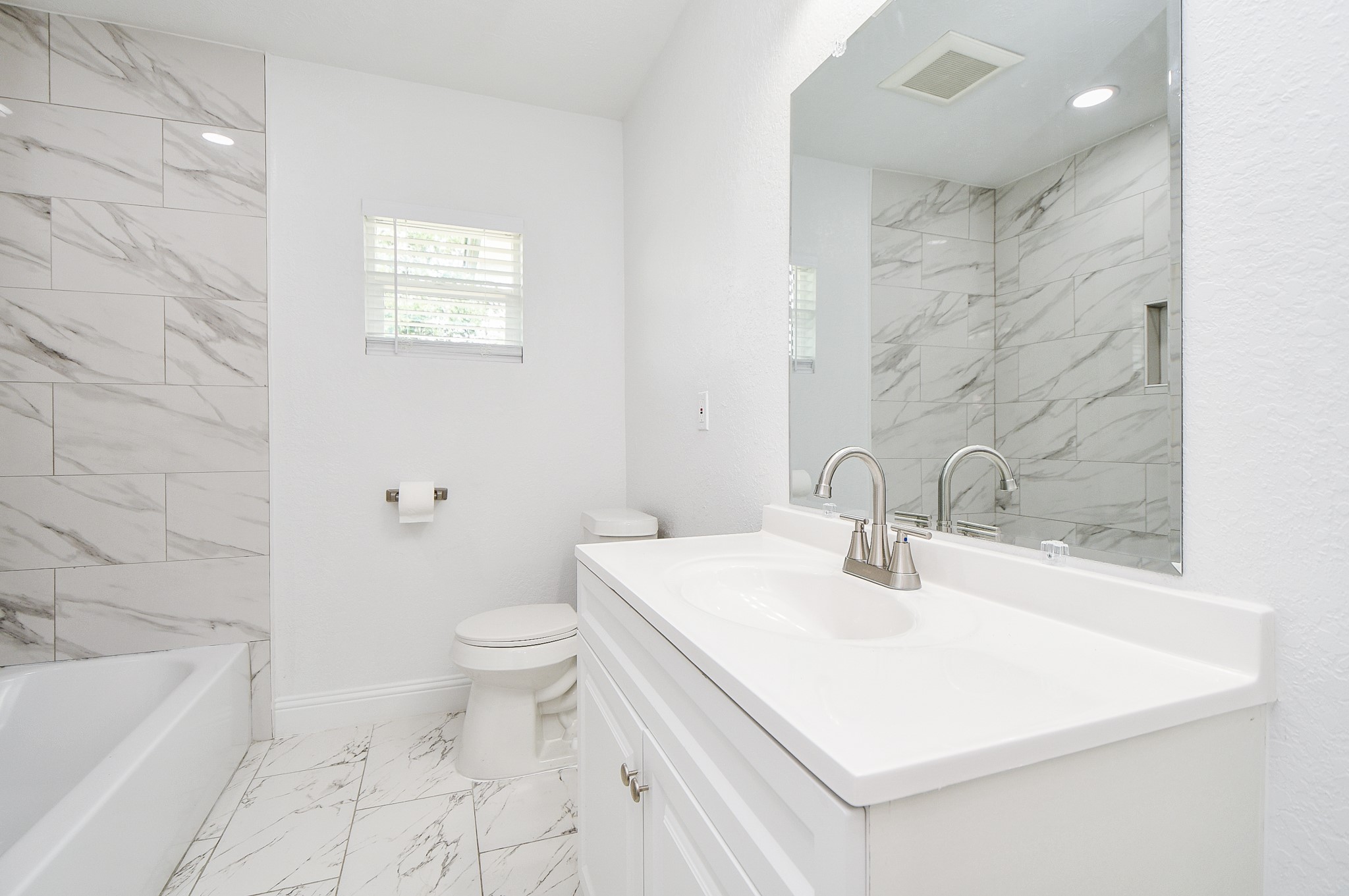 5814 Belneath Street Houston, TX 77033 - Photo 19 of 32 a bathroom with a sink a toilet and shower