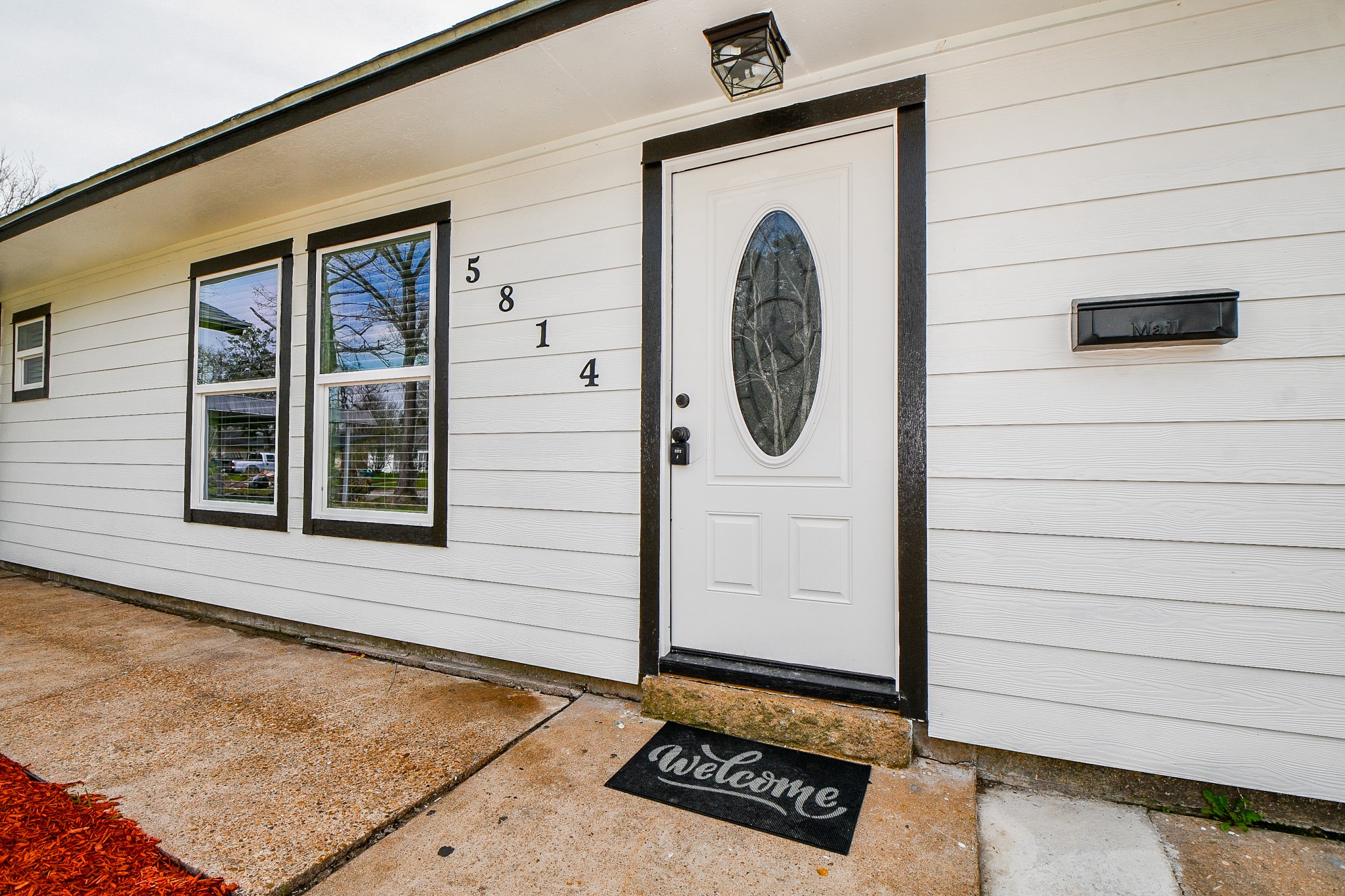 5814 Belneath Street Houston, TX 77033 - Photo 6 of 32 a front view of a house with entryway
