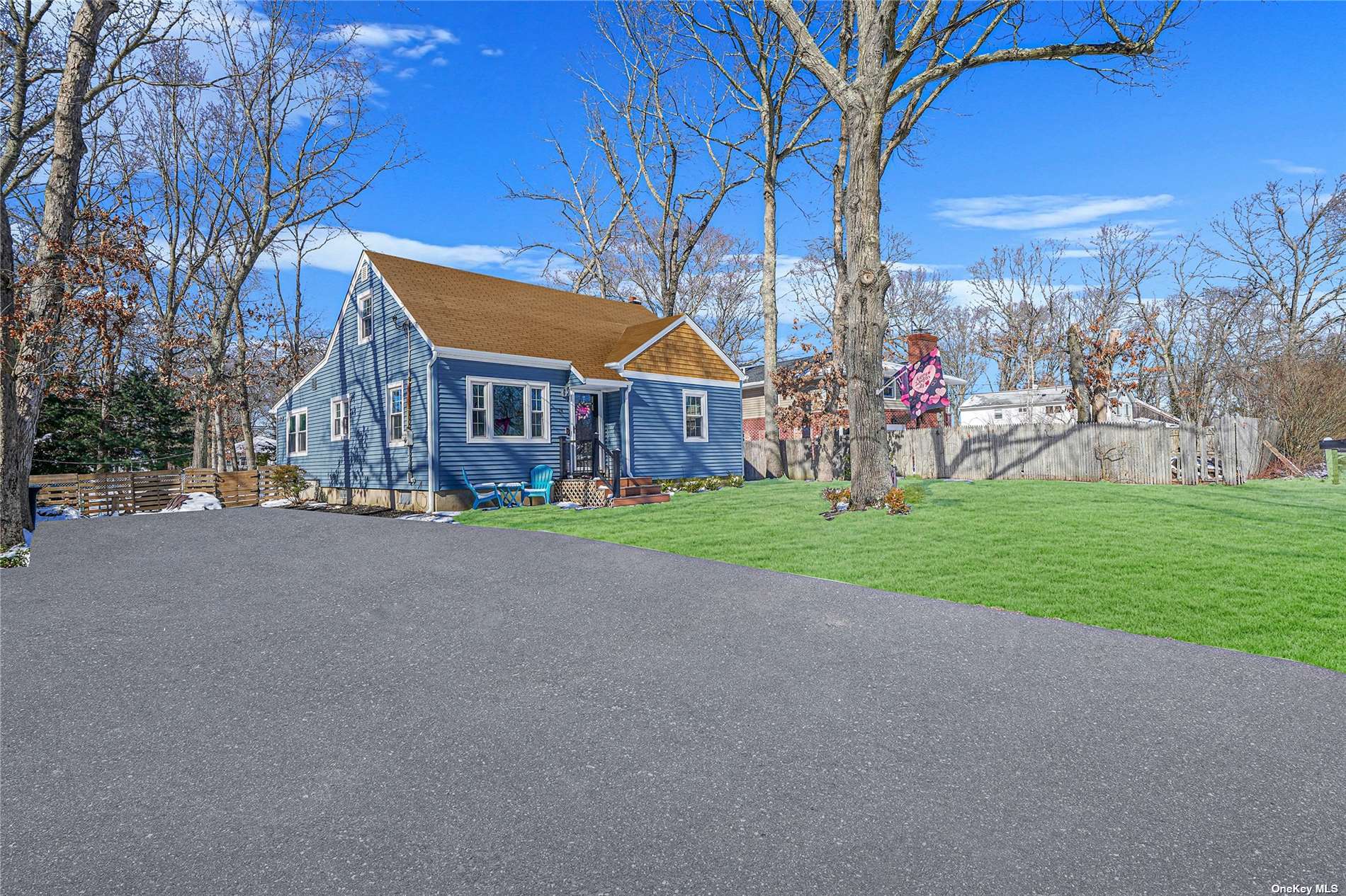 24 Corchaug Trail Ridge, NY 11961 - Photo 1 of 1 a view of a house with a big yard and large trees