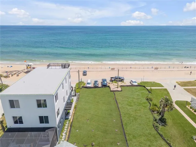a view of a swimming pool with an outdoor seating