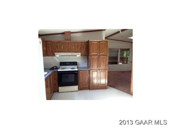 5572 Frank Lane Road Crozet, VA 22932 - Photo 9 of 22 a kitchen with stainless steel appliances a refrigerator and a stove