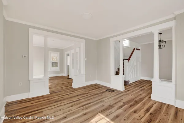 a view of entryway with wooden floor