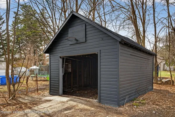 a view of a wooden door and a yard