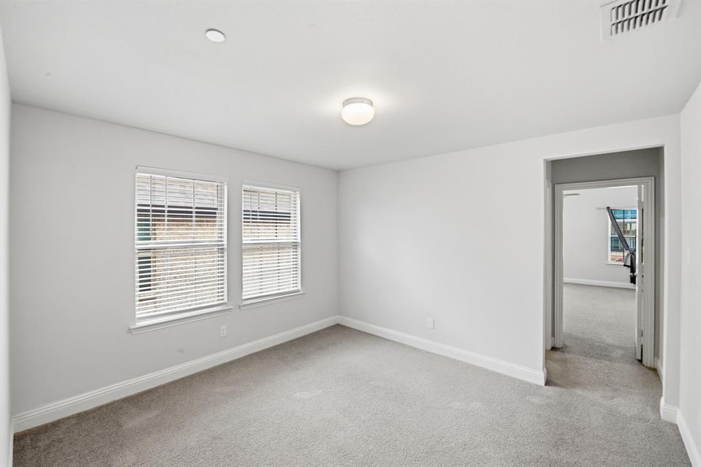 5960 Bursey Road Watauga, TX 76148 - Photo 21 of 38 an empty room with windows
