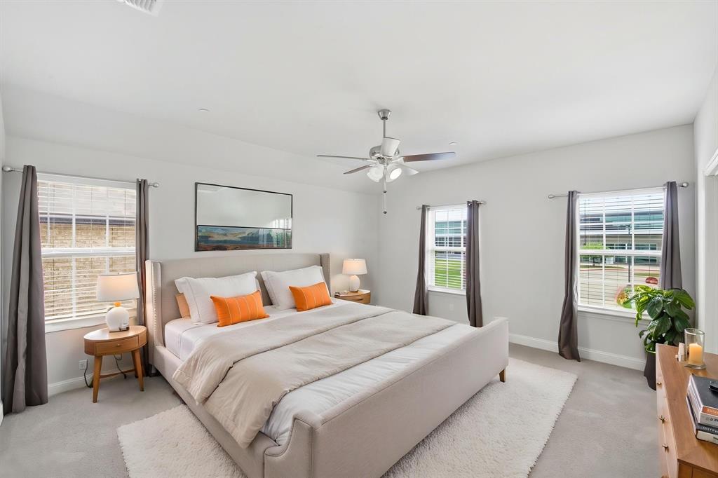 5960 Bursey Road Watauga, TX 76148 - Photo 24 of 38 a bedroom with a large bed and potted plant