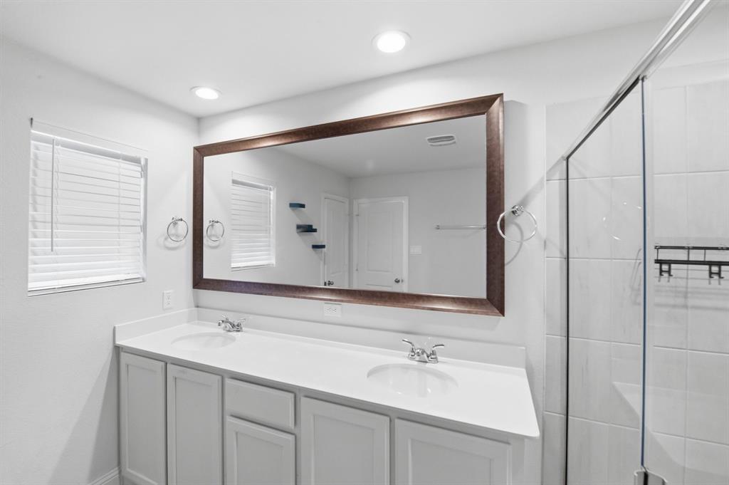 5960 Bursey Road Watauga, TX 76148 - Photo 28 of 38 a bathroom with a double vanity sink mirror and