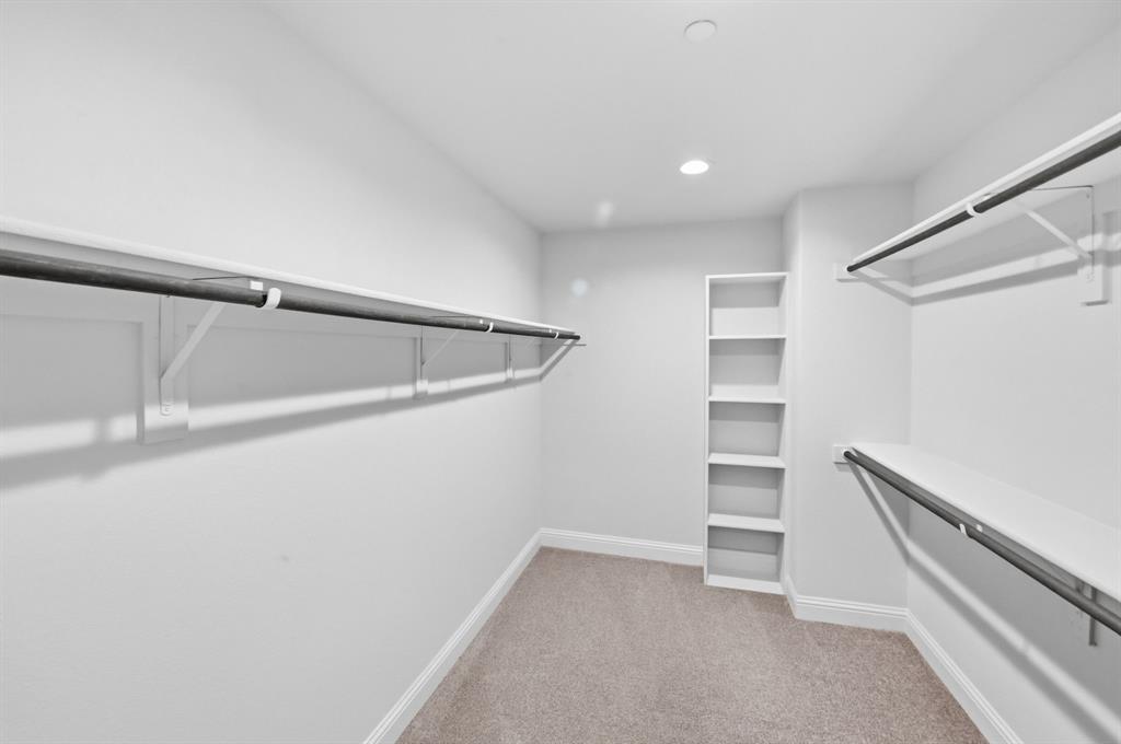 5960 Bursey Road Watauga, TX 76148 - Photo 29 of 38 a view of an empty walk in closet