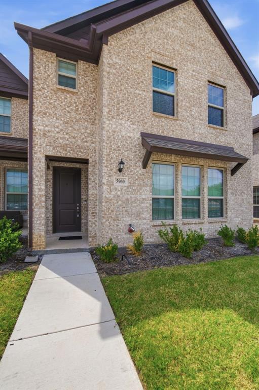 5960 Bursey Road Watauga, TX 76148 - Photo 4 of 38 a front view of a house with garden