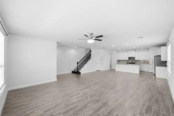a view of a kitchen with a sink and a stove top oven