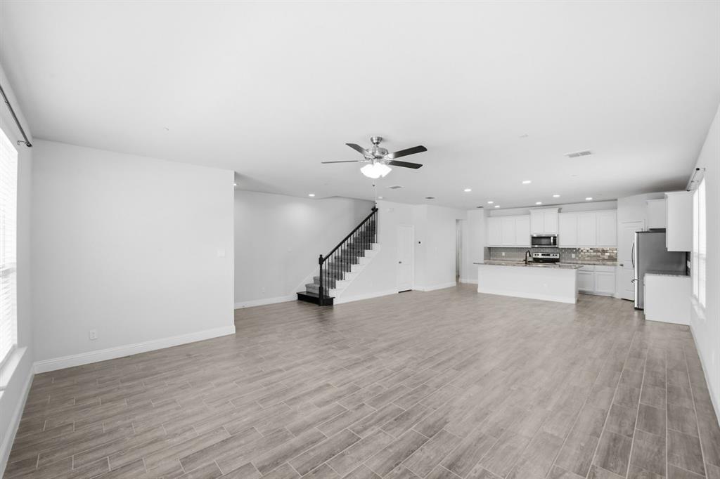 5960 Bursey Road Watauga, TX 76148 - Photo 10 of 38 a view of a kitchen with a sink and a stove top oven