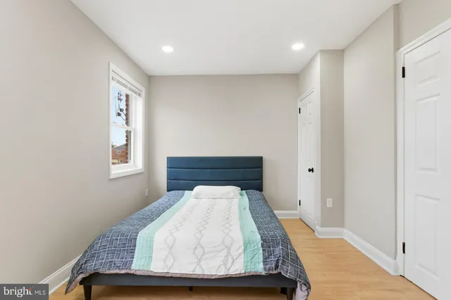 a room with a bed and a window