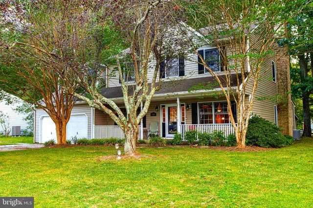 front view of a house with a yard