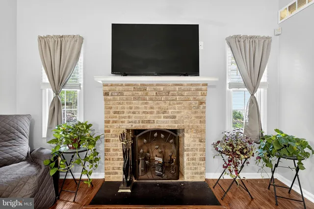 a view of a bedroom with furniture and window